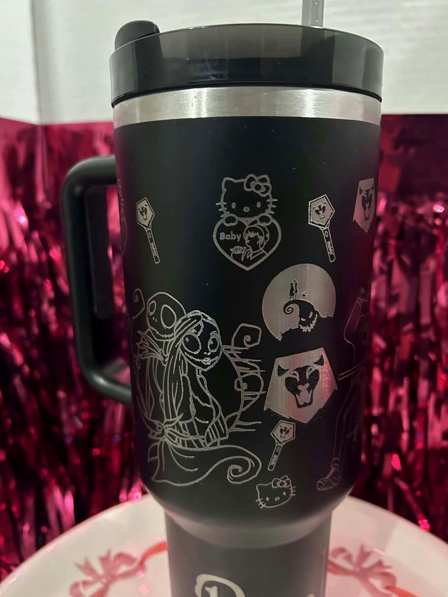 Laser engraved black tumbler with custom character designs